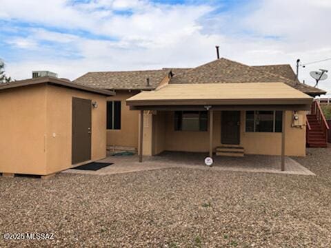 1048 E 7th St, Tucson, AZ 85719 - rear view of house featuring a patio area, stucco siding, entry steps, and an outbuilding