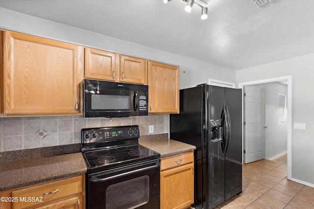 807 N Manzanita Pl, Saint David, AZ 85630 - kitchen featuring black appliances, light tile patterned flooring, decorative backsplash, and dark stone counters
