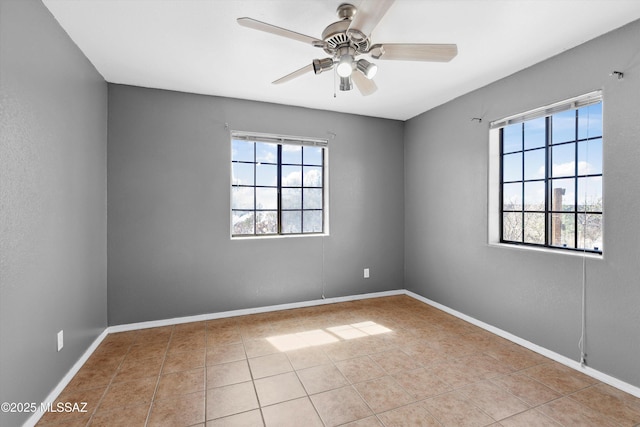 807 N Manzanita Pl, Saint David, AZ 85630 - spare room with healthy amount of natural light, tile patterned flooring, and ceiling fan