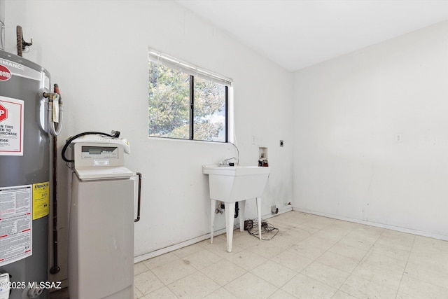807 N Manzanita Pl, Saint David, AZ 85630 - washroom featuring gas water heater, hookup for a washing machine, tile patterned floors, and hookup for an electric dryer