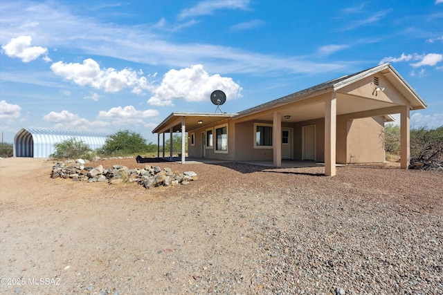 807 N Manzanita Pl, Saint David, AZ 85630 - back of property featuring stucco siding and a patio area