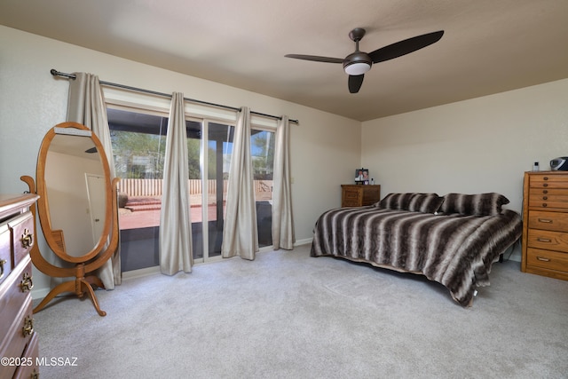 8142 N Modena Dr, Tucson, AZ 85742 - carpeted bedroom featuring access to exterior and ceiling fan