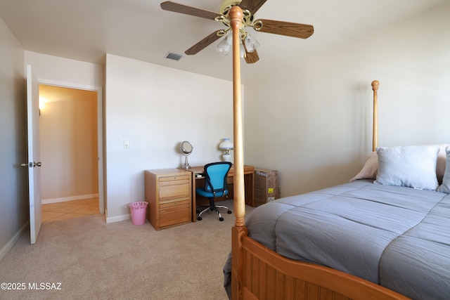 8142 N Modena Dr, Tucson, AZ 85742 - bedroom featuring light carpet and a ceiling fan