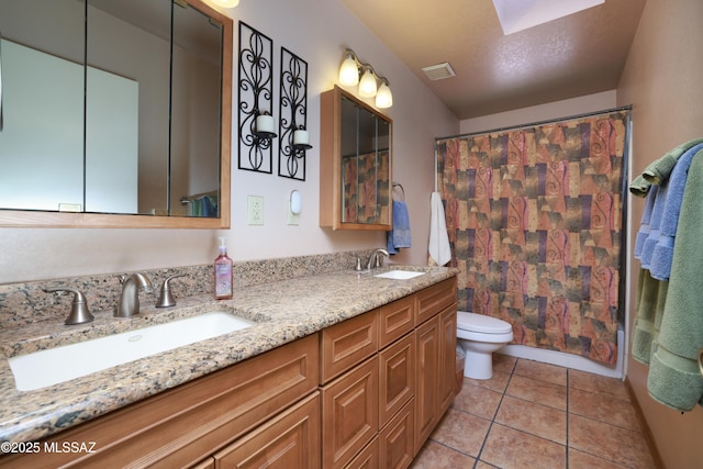 8142 N Modena Dr, Tucson, AZ 85742 - full bath featuring double vanity, a skylight, tile patterned flooring, and a shower with shower curtain