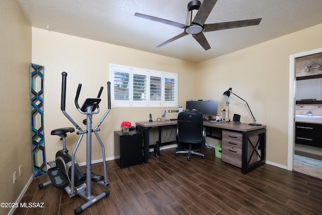 8142 N Modena Dr, Tucson, AZ 85742 - home office with a ceiling fan and dark wood-style flooring