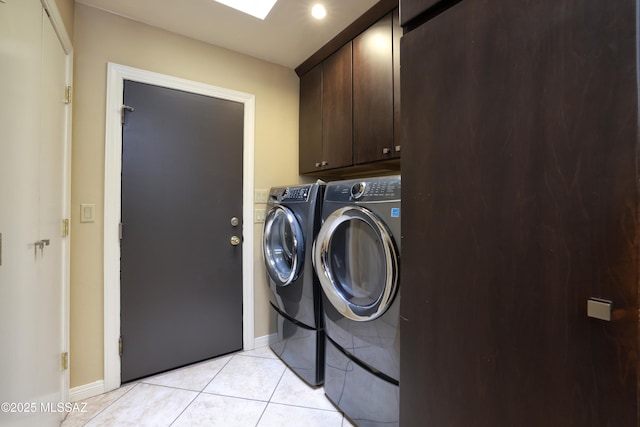8142 N Modena Dr, Tucson, AZ 85742 - laundry room featuring washer and clothes dryer, cabinet space, and light tile patterned flooring