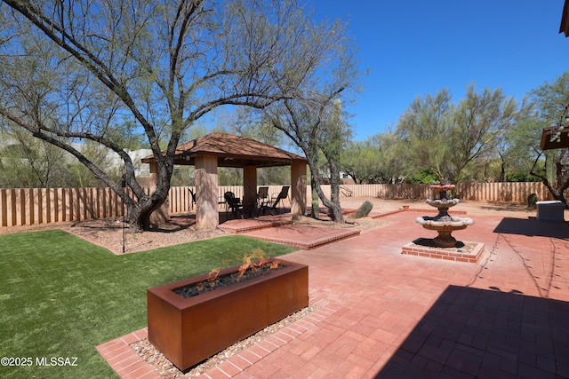 8142 N Modena Dr, Tucson, AZ 85742 - fenced backyard with a patio, a gazebo, and an outdoor fire pit