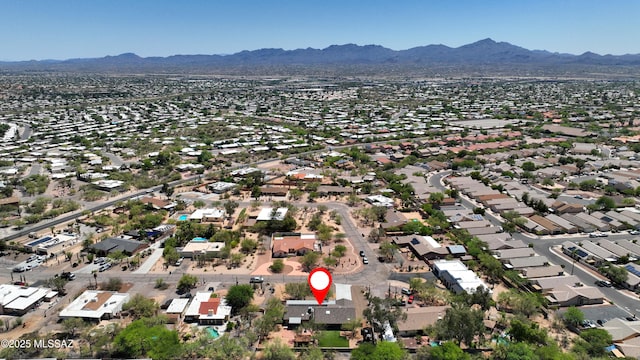 8142 N Modena Dr, Tucson, AZ 85742 - aerial view of property and surrounding area featuring a mountain backdrop and nearby suburban area