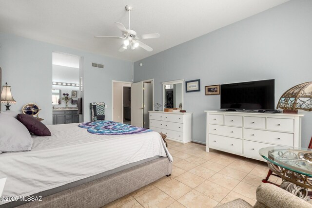938 E Grass Meadow Pl, Oro Valley, AZ 85755 - bedroom featuring light tile patterned floors, ensuite bathroom, a ceiling fan, and vaulted ceiling