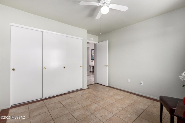 938 E Grass Meadow Pl, Oro Valley, AZ 85755 - unfurnished bedroom with a closet and ceiling fan