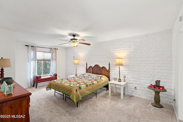 8450 E Old Spanish Trl Apt 154, Tucson, AZ 85710 - bedroom featuring carpet floors, brick wall, and a ceiling fan