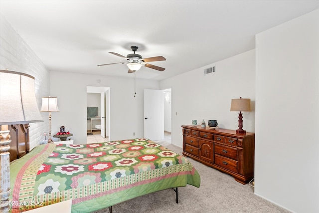 8450 E Old Spanish Trl Apt 154, Tucson, AZ 85710 - bedroom featuring light carpet, ceiling fan, and connected bathroom
