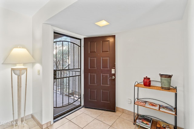 8450 E Old Spanish Trl Apt 154, Tucson, AZ 85710 - entrance foyer featuring baseboards and light tile patterned floors