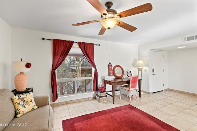 8450 E Old Spanish Trl Apt 154, Tucson, AZ 85710 - tiled living area featuring a ceiling fan and baseboards