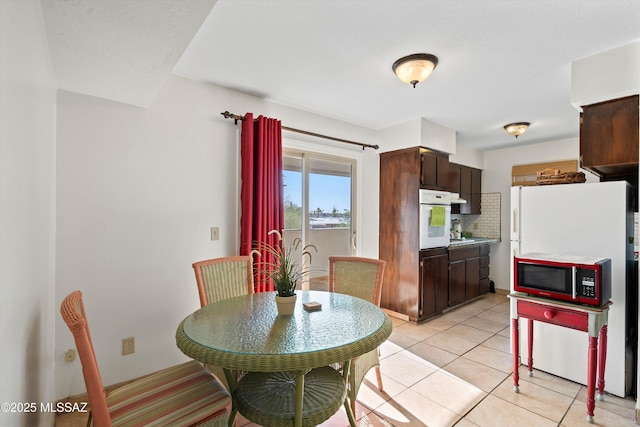 8450 E Old Spanish Trl Apt 154, Tucson, AZ 85710 - dining area with light tile patterned floors