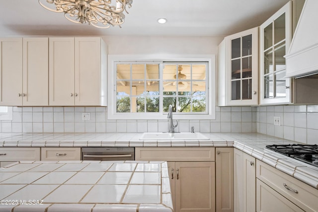 5015 N Via Condesa, Tucson, AZ 85718 - kitchen with premium range hood, dishwasher, a chandelier, backsplash, and white cabinets