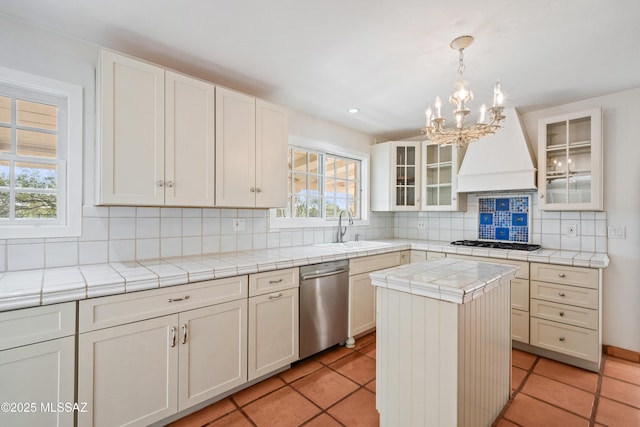 5015 N Via Condesa, Tucson, AZ 85718 - kitchen featuring stainless steel dishwasher, premium range hood, gas stovetop, a chandelier, and tile counters