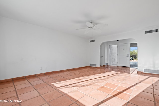 5015 N Via Condesa, Tucson, AZ 85718 - tiled spare room featuring arched walkways and a ceiling fan