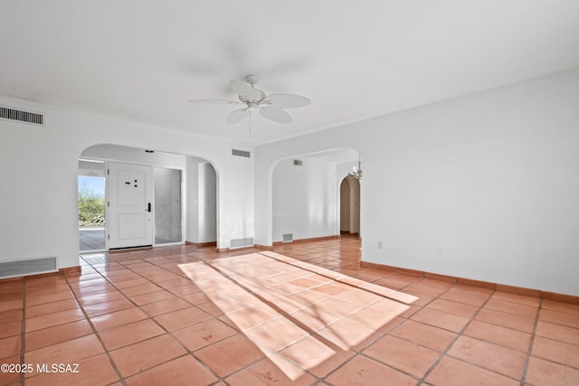 5015 N Via Condesa, Tucson, AZ 85718 - tiled spare room featuring arched walkways and ceiling fan