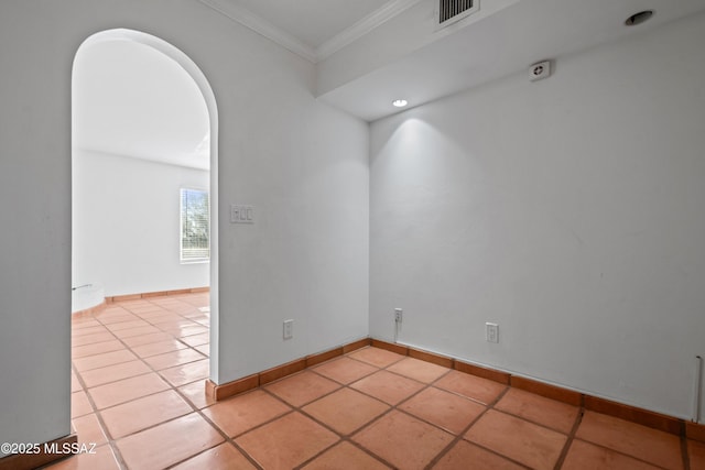 5015 N Via Condesa, Tucson, AZ 85718 - empty room with ornamental molding, arched walkways, and light tile patterned floors