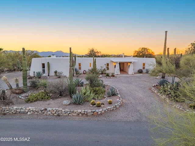 5015 N Via Condesa, Tucson, AZ 85718 - mid-century home with stucco siding, driveway, and a mountain view