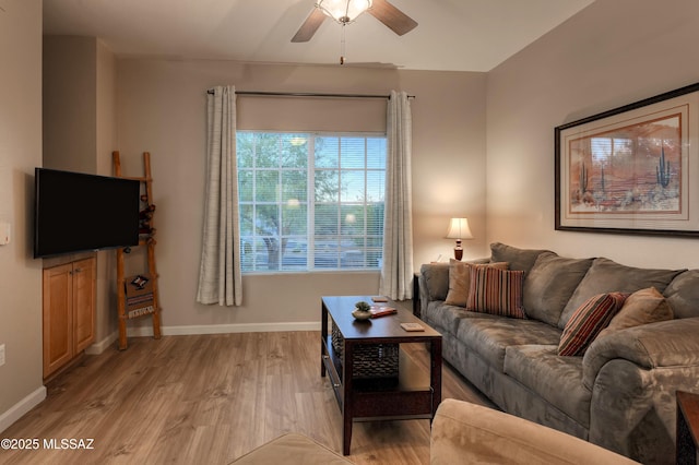 1500 E Pusch Wilderness Dr Unit 2103, Tucson, AZ 85737 - living room featuring a ceiling fan and light wood-style flooring