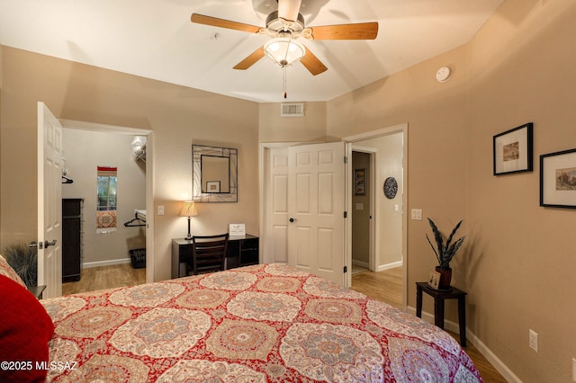 1500 E Pusch Wilderness Dr Unit 2103, Tucson, AZ 85737 - bedroom featuring wood finished floors and a ceiling fan