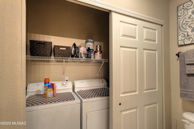 1500 E Pusch Wilderness Dr Unit 2103, Tucson, AZ 85737 - washroom with washer and clothes dryer and a textured wall