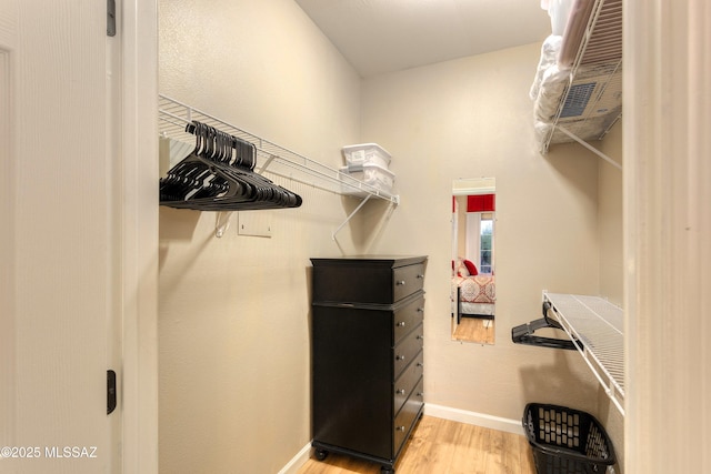 1500 E Pusch Wilderness Dr Unit 2103, Tucson, AZ 85737 - spacious closet featuring light wood-type flooring