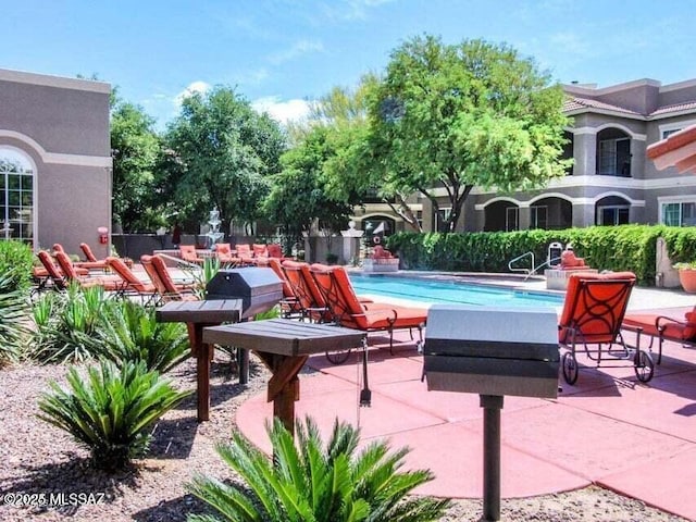 1500 E Pusch Wilderness Dr Unit 2103, Tucson, AZ 85737 - community pool with a patio area