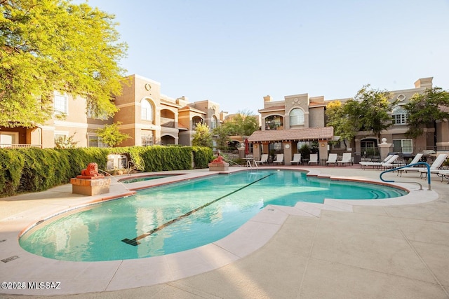 1500 E Pusch Wilderness Dr Unit 2103, Tucson, AZ 85737 - community pool featuring a patio and a hot tub