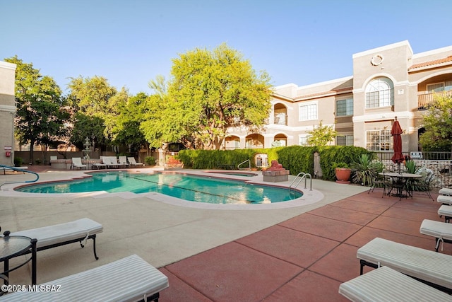 1500 E Pusch Wilderness Dr Unit 2103, Tucson, AZ 85737 - community pool with a patio area and a hot tub