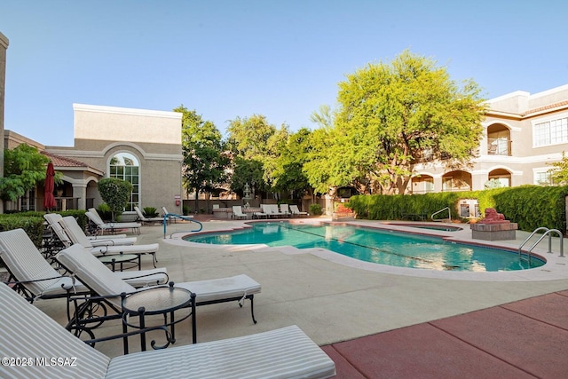 1500 E Pusch Wilderness Dr Unit 2103, Tucson, AZ 85737 - view of pool with a patio area and an in-ground hot tub
