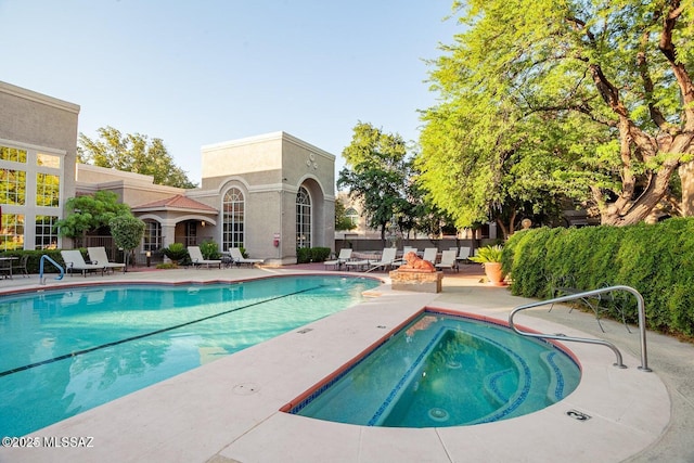 1500 E Pusch Wilderness Dr Unit 2103, Tucson, AZ 85737 - community pool featuring a patio area and an in-ground hot tub