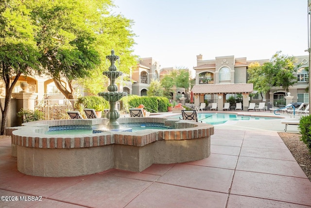 1500 E Pusch Wilderness Dr Unit 2103, Tucson, AZ 85737 - surrounding community featuring a patio area and a swimming pool