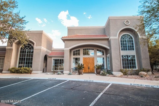 1500 E Pusch Wilderness Dr Unit 2103, Tucson, AZ 85737 - view of building exterior with uncovered parking