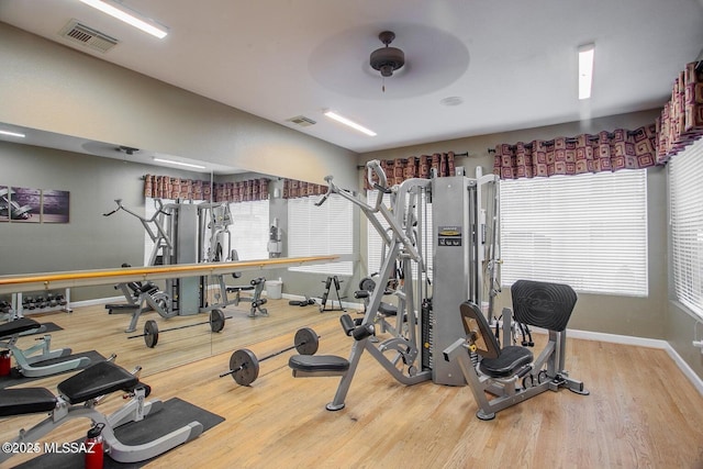 1500 E Pusch Wilderness Dr Unit 2103, Tucson, AZ 85737 - workout area featuring wood finished floors, ceiling fan, and plenty of natural light