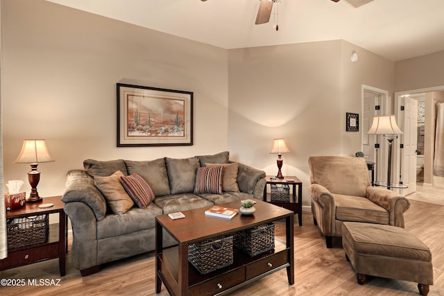 1500 E Pusch Wilderness Dr Unit 2103, Tucson, AZ 85737 - living room featuring light wood-style floors and a ceiling fan