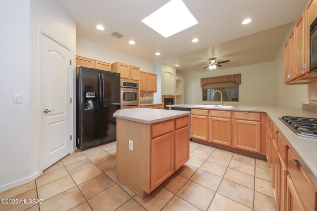 14085 E Copper Mesa Ct, Vail, AZ 85641 - kitchen featuring black appliances, a peninsula, light countertops, a kitchen island, and recessed lighting