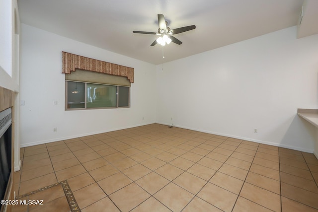 14085 E Copper Mesa Ct, Vail, AZ 85641 - unfurnished living room featuring a ceiling fan, a fireplace, and light tile patterned floors