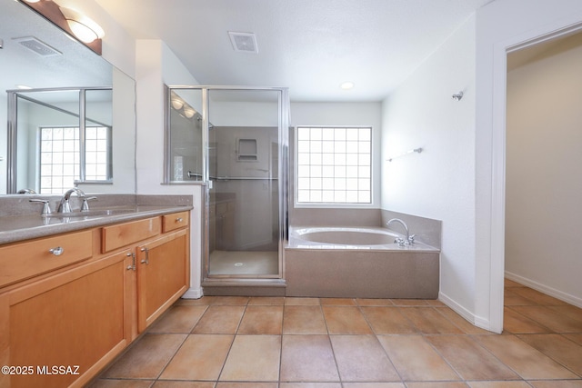 14085 E Copper Mesa Ct, Vail, AZ 85641 - full bath with vanity, a garden tub, a shower stall, and tile patterned flooring