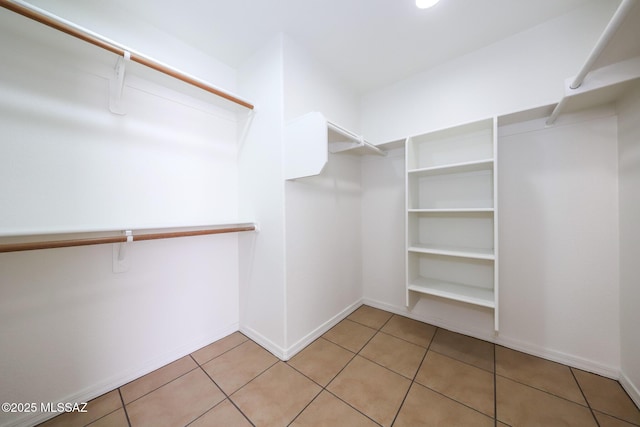 14085 E Copper Mesa Ct, Vail, AZ 85641 - walk in closet featuring light tile patterned flooring