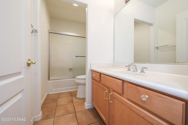 14085 E Copper Mesa Ct, Vail, AZ 85641 - bathroom with vanity, tile patterned flooring, and enclosed tub / shower combo
