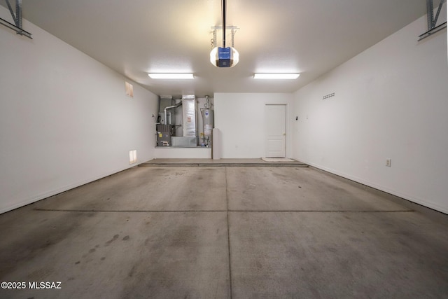 14085 E Copper Mesa Ct, Vail, AZ 85641 - garage with heating unit, water heater, and a garage door opener