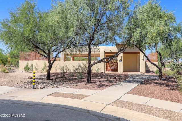 14085 E Copper Mesa Ct, Vail, AZ 85641 - adobe home featuring a fenced front yard and stucco siding