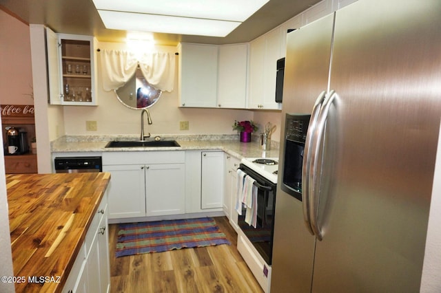 326 N Sage St, Pearce, AZ 85625 - kitchen featuring stainless steel refrigerator with ice dispenser, white electric range oven, wooden counters, wood finished floors, and white cabinetry