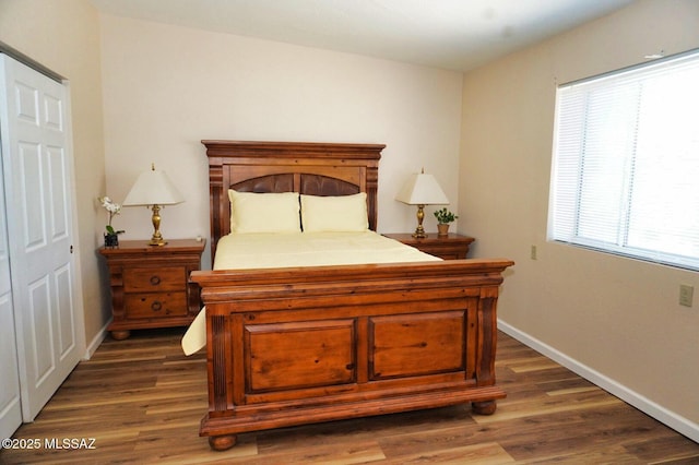 326 N Sage St, Pearce, AZ 85625 - bedroom with dark wood finished floors and baseboards
