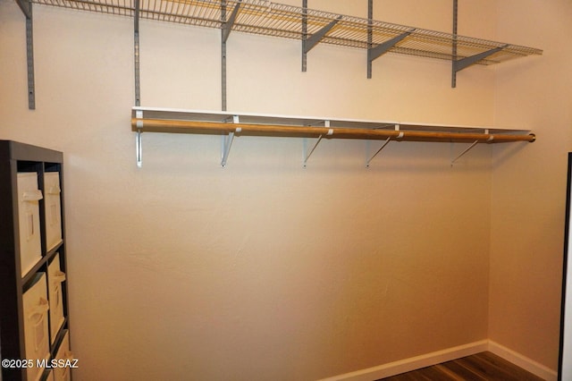 326 N Sage St, Pearce, AZ 85625 - walk in closet with dark wood-type flooring