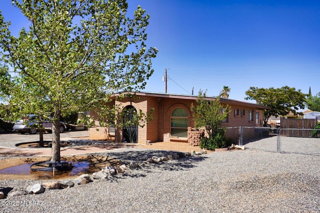 326 N Sage St, Pearce, AZ 85625 - view of front of home with a gate and brick siding