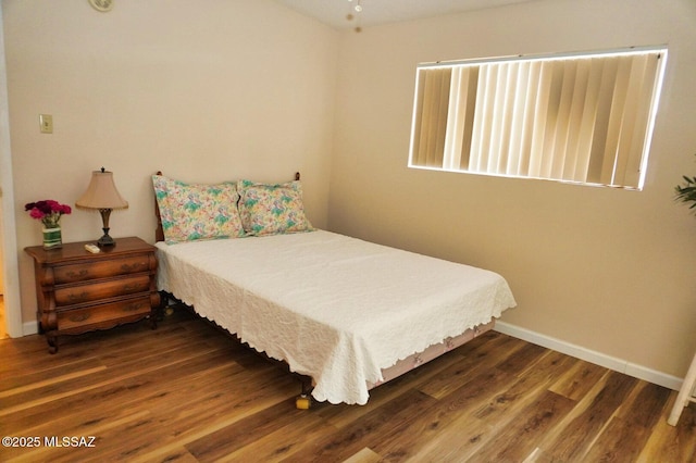 326 N Sage St, Pearce, AZ 85625 - bedroom featuring wood finished floors and baseboards